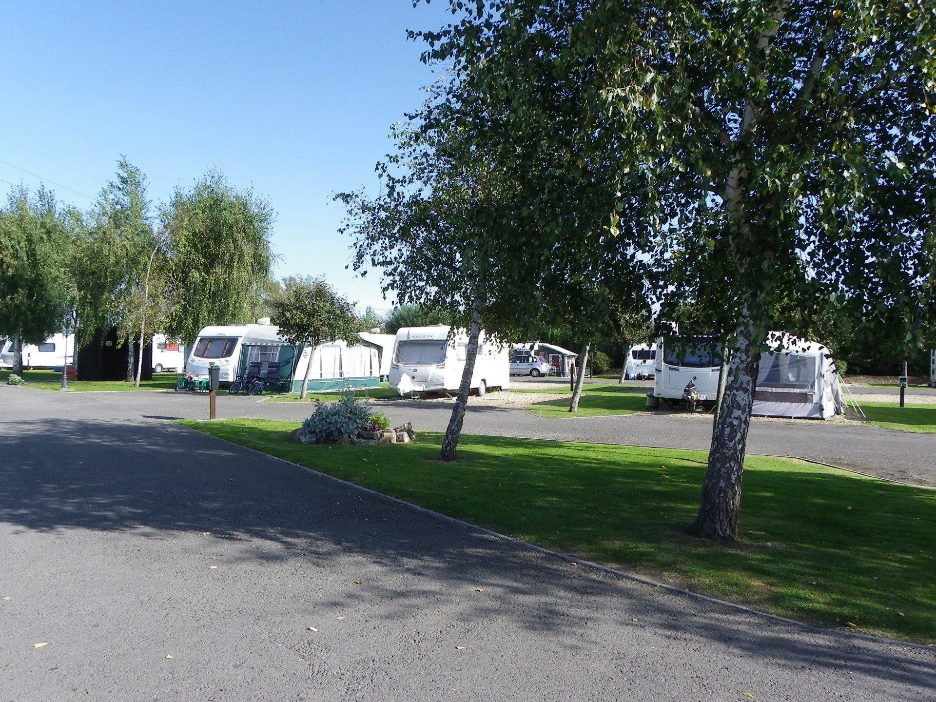 Caravans with awnings at Coombes Cider Farm.