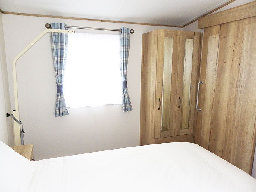 wheelchair accessible holiday caravan bedroom with hoist