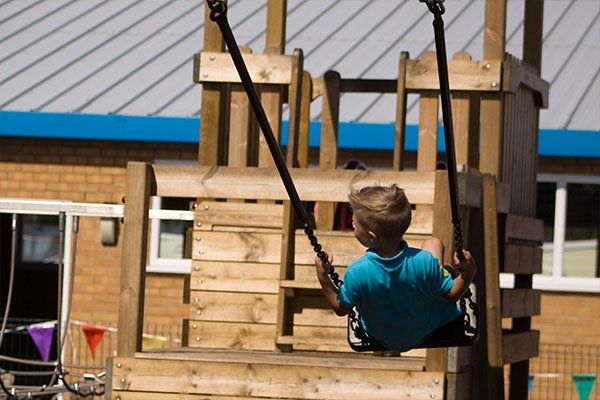 Child on a swing set