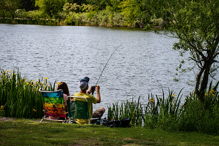 Couple fishing on the lake at our holiday park