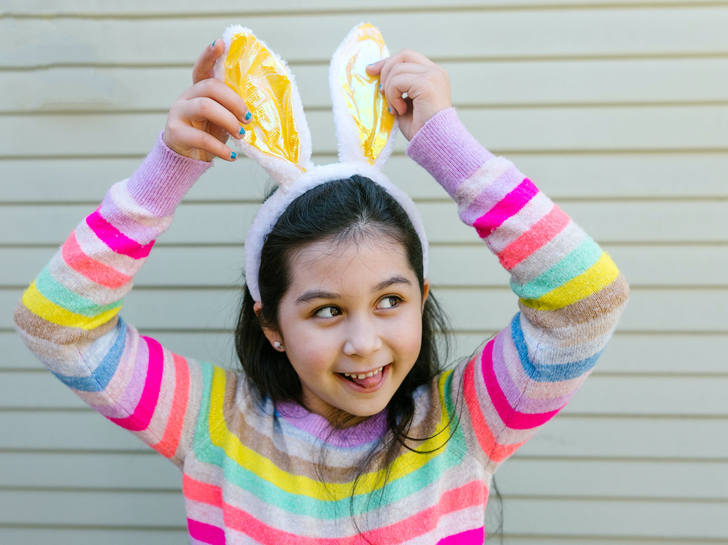 Young girl wearing easter bunny ears