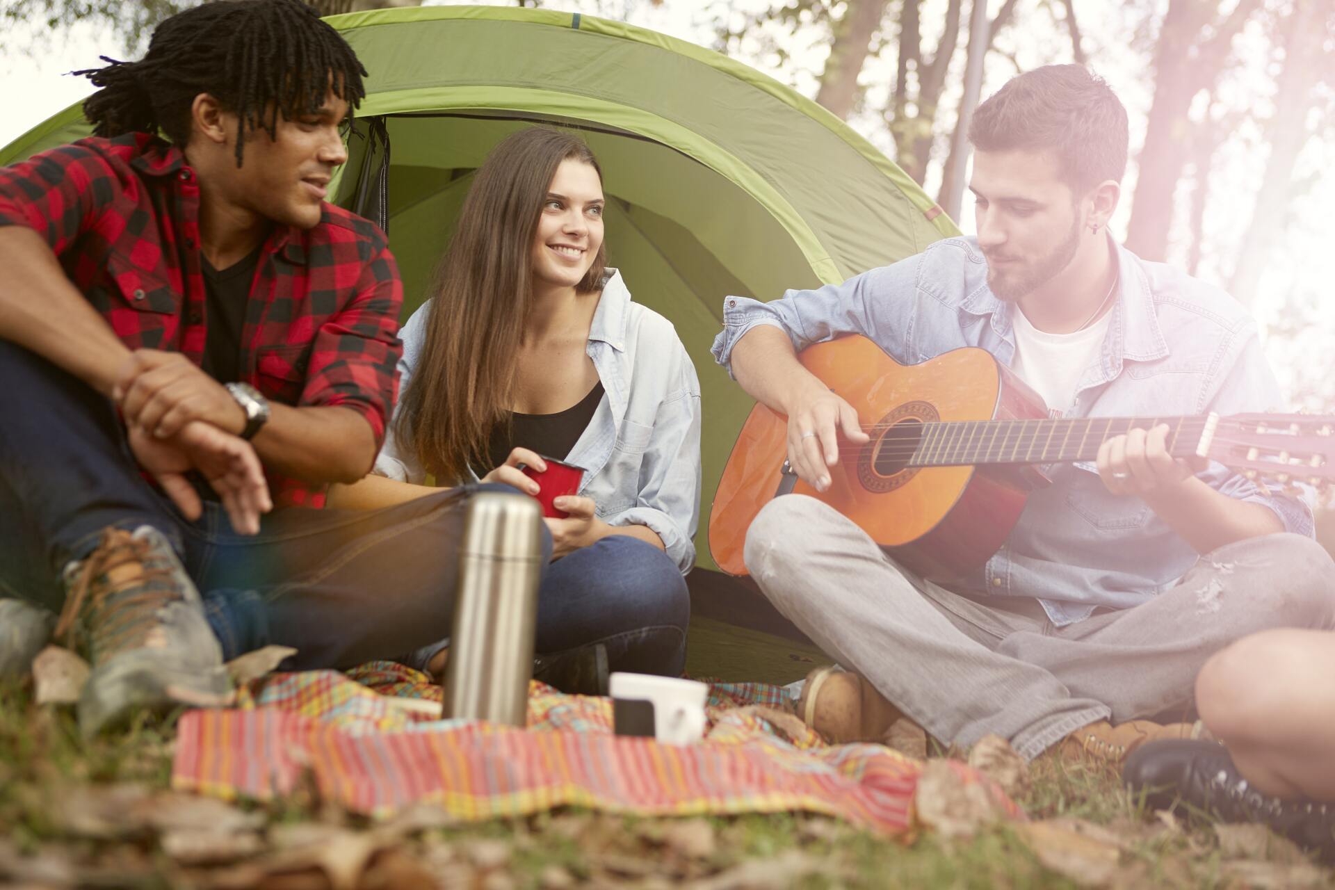 Young adults enjoy a campsite