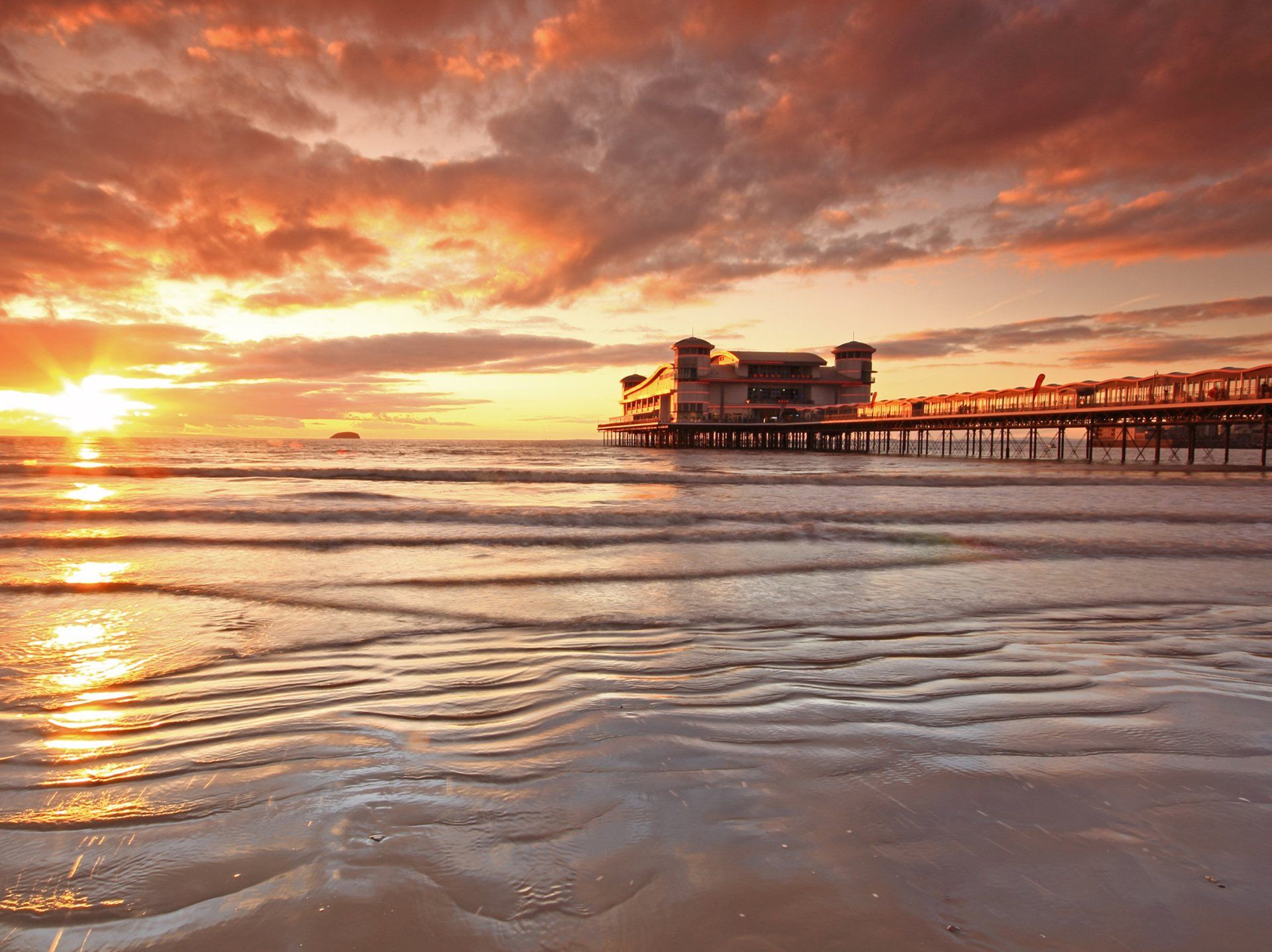 The sun sets behind the Grand Pier in Weston-super-Mare