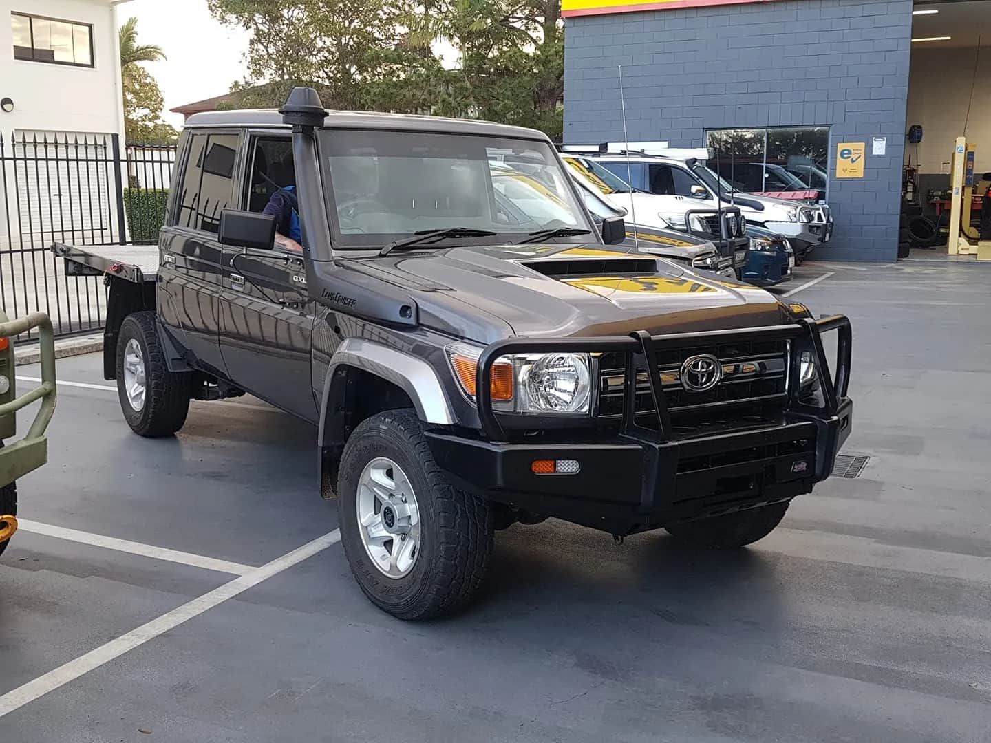 Black Toyota Land Cruiser Truck With Snorkel, Parked Outside a Building — GZM 4x4 Performance In Ballina, NSW