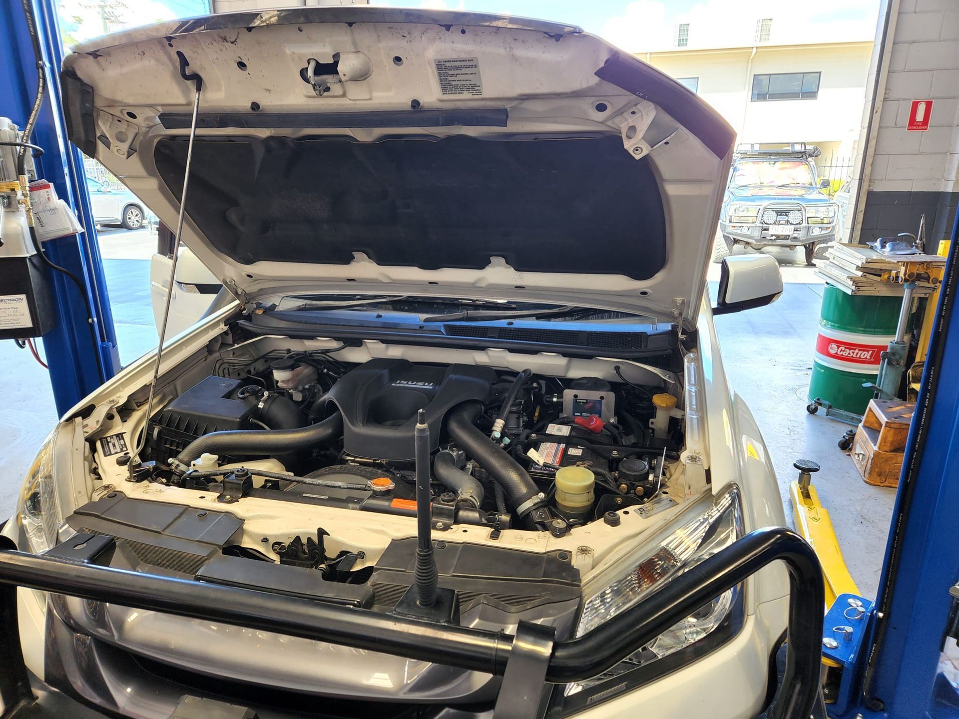 White Truck With Hood Open in a Garage, Engine Exposed, on a Lift — GZM 4x4 Performance In Ballina, NSW