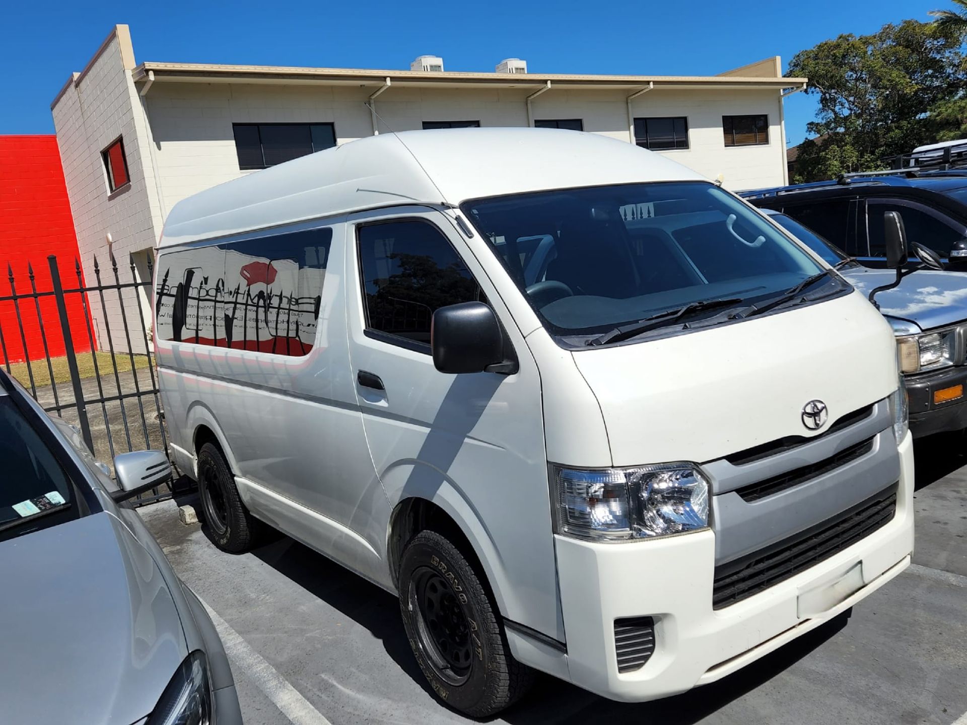 White Toyota Hiace Van Parked in a Lot, Near a Building — GZM 4x4 Performance In Ballina, NSW