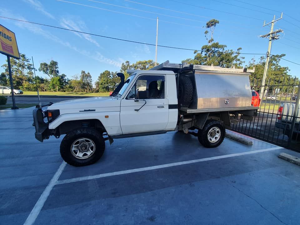 White Toyota Land Cruiser Pickup Truck Parked Outside — GZM 4x4 Performance In Ballina, NSW