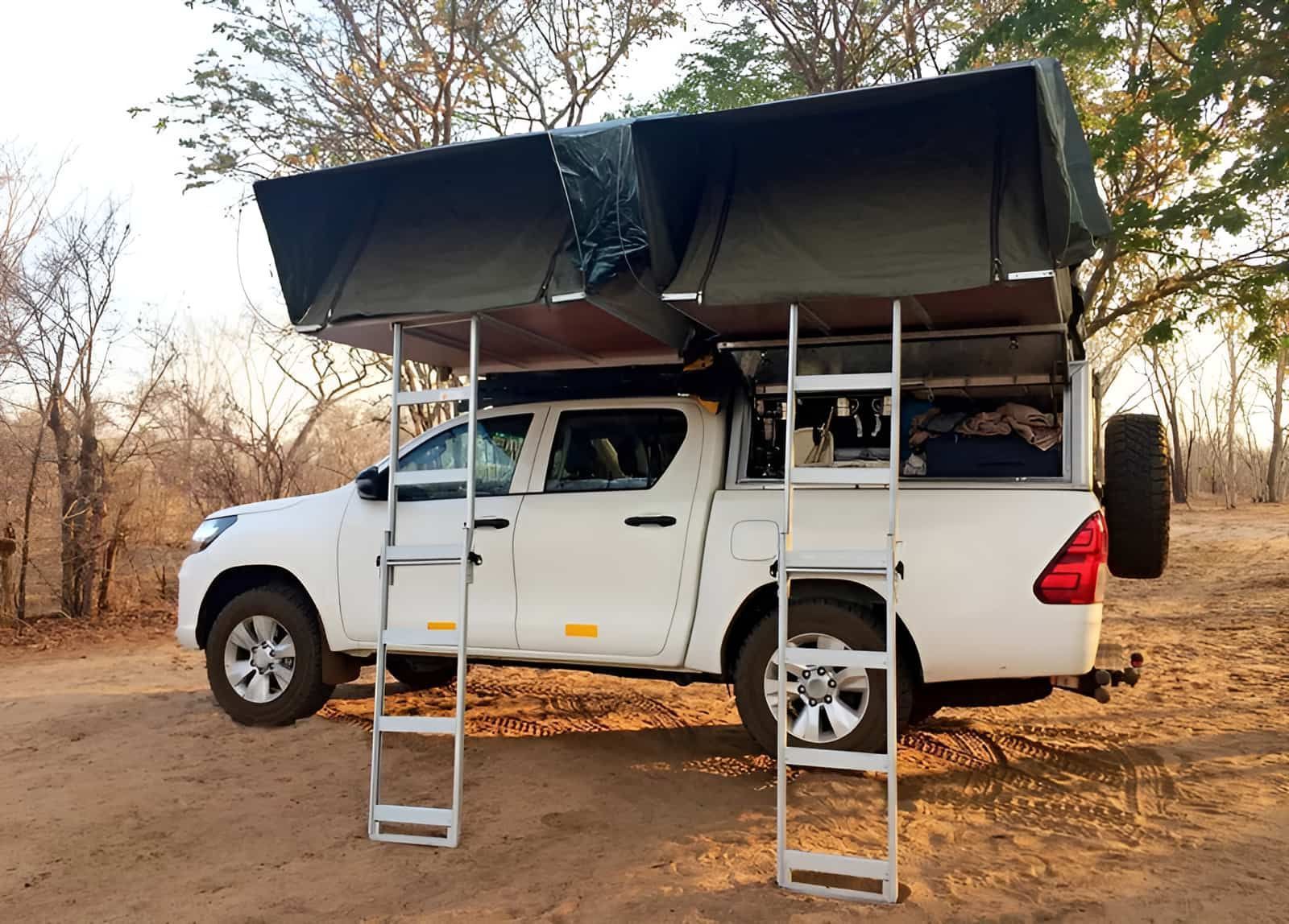 White Pickup Truck With Rooftop Tents Set Up in an Outdoor — GZM 4x4 Performance In Ballina, NSW