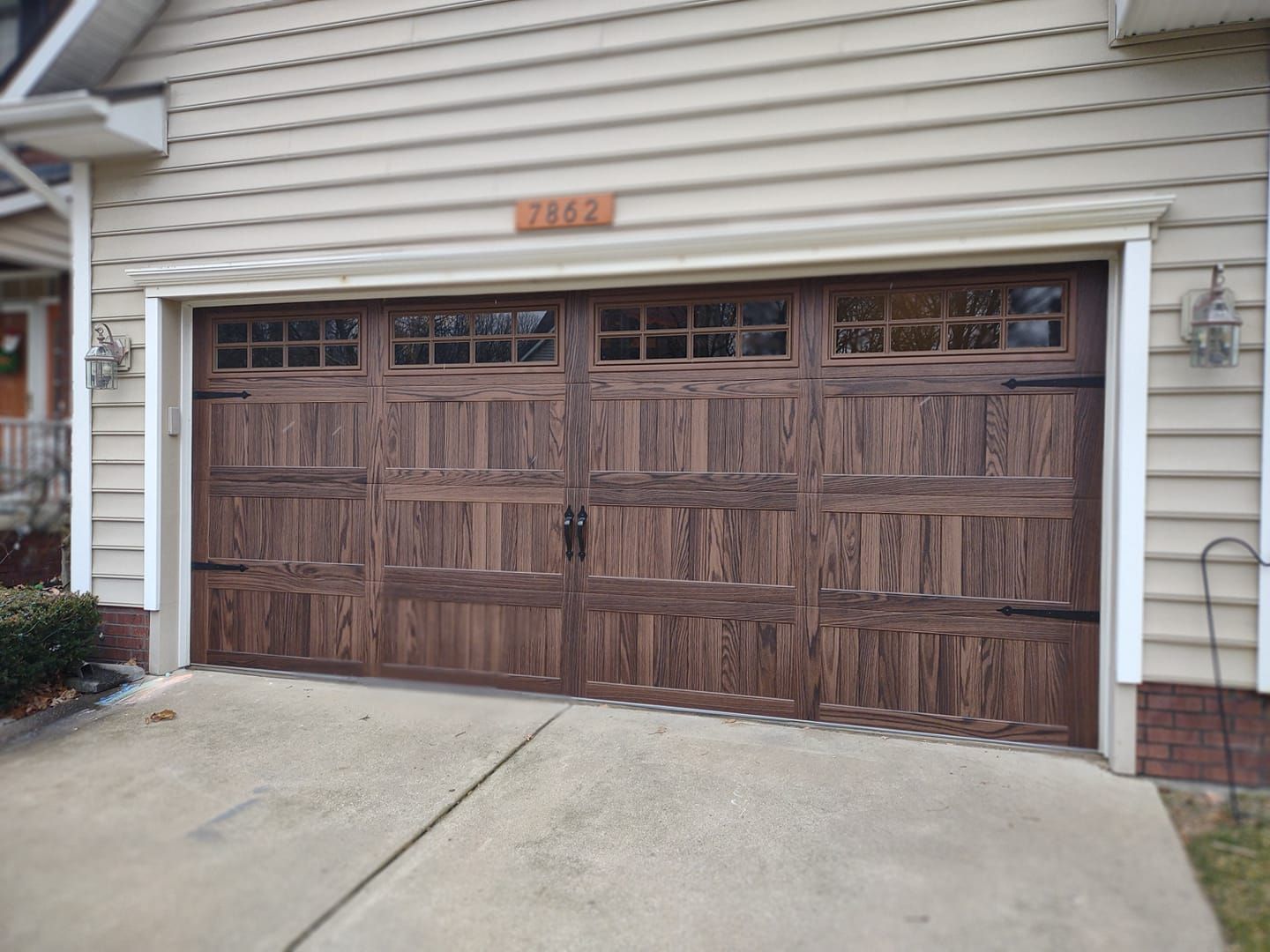A house with a large wooden garage door