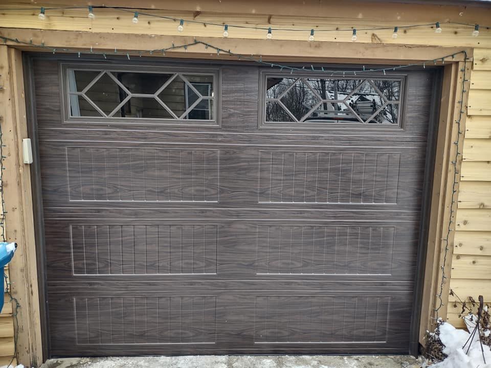 A garage door with a window in the middle of it.