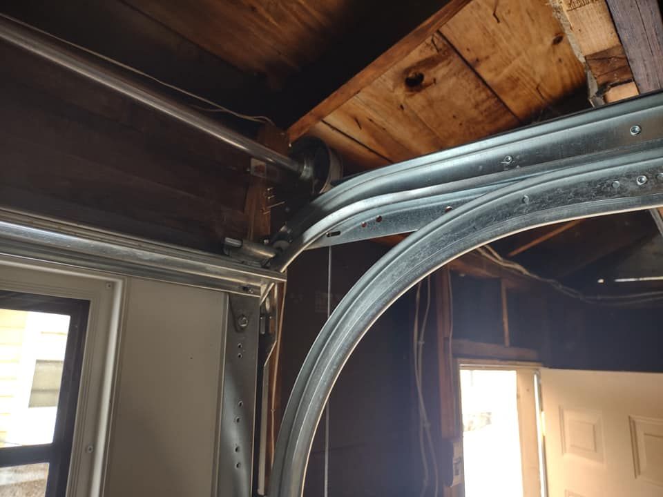 A close up of a garage door with a wooden ceiling