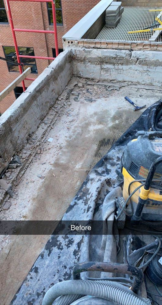A vacuum cleaner is sitting on the roof of a building.