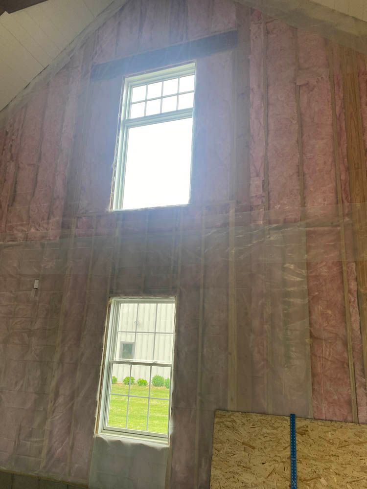 A room with a lot of insulation and a window.