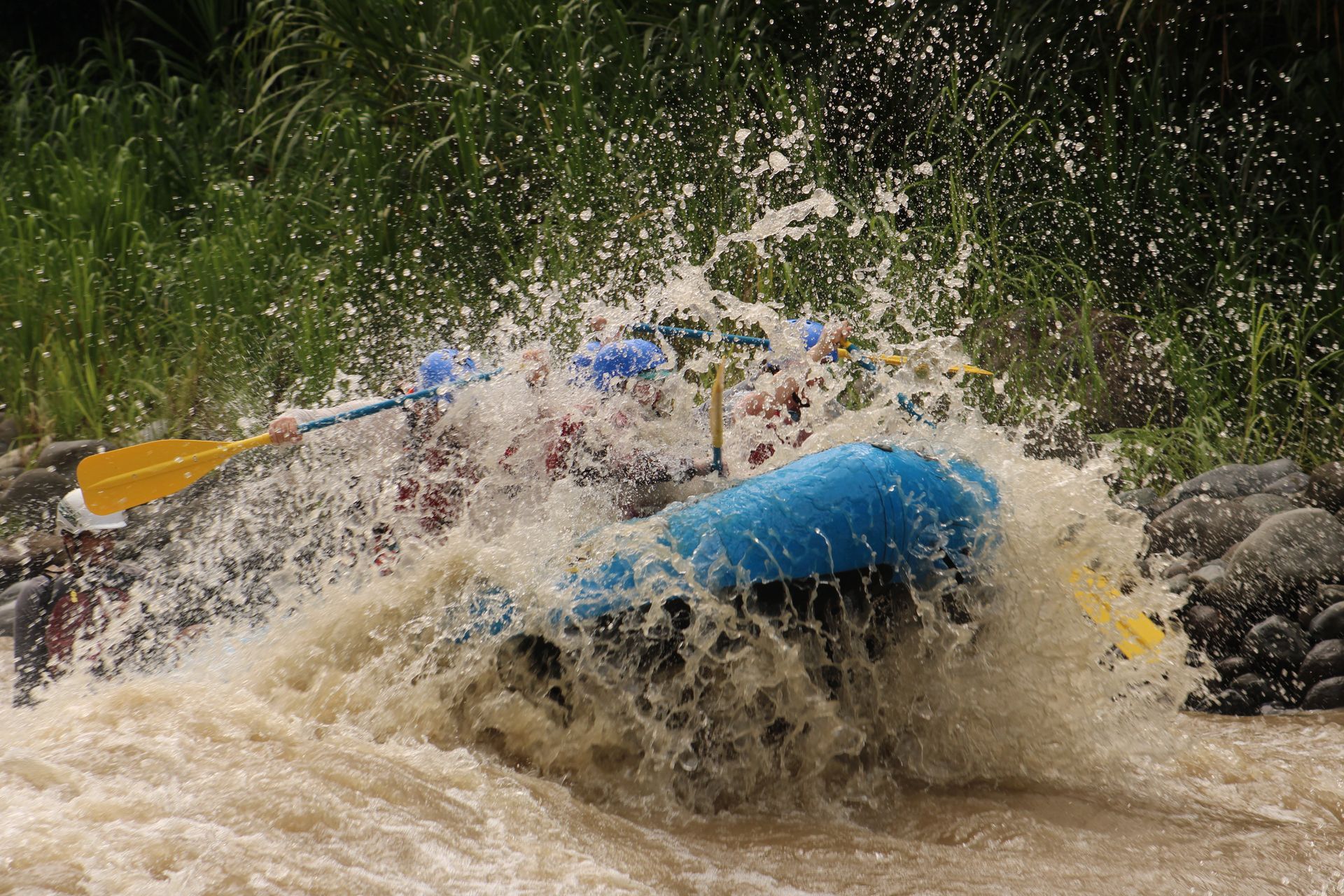 A group of people are rafting down a river.