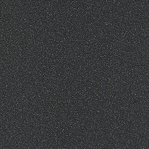 Et nærbillede af en sort overflade med en kornet tekstur.