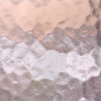 Et nærbillede af en hamret glastekstur.