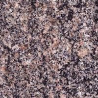 Et nærbillede af en granitoverflade med en masse små sten.