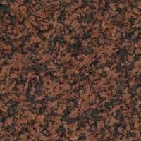 Et nærbillede af en bordplade i rød granit.