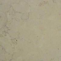 Et nærbillede af en hvid marmorflise med marmortekstur.