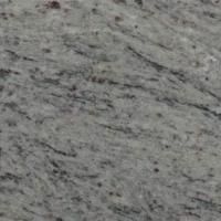 Et nærbillede af en hvid granit bordplade.