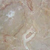 Et nærbillede af en marmorflise med et hul i.