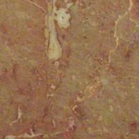 Et nærbillede af en brun marmorflise med marmortekstur.