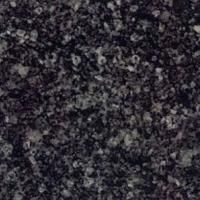 Et nærbillede af en sort granit bordplade.