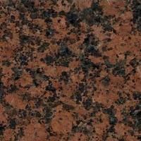 Et nærbillede af en bordplade i rød granit.