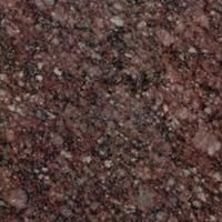 Et nærbillede af en bordplade i rød granit.