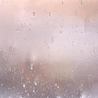 Et nærbillede af regndråber på et vindue.