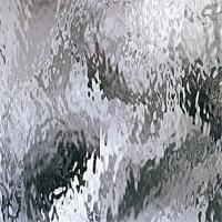 Et nærbillede af et stykke glas med en grå og sort tekstur.