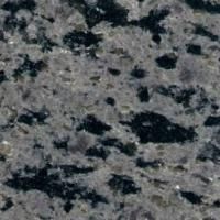 Et nærbillede af en bordplade i grå og sort granit.