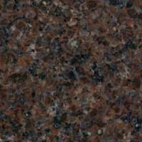 Et nærbillede af en bordplade af brun granit.