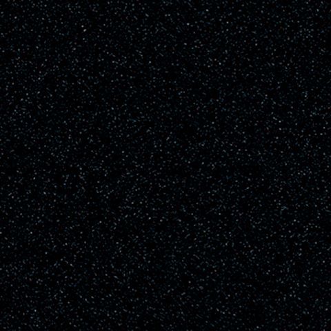 Et nærbillede af en sort overflade med hvide prikker på.