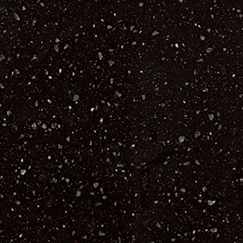 Et nærbillede af en sort overflade med hvide pletter