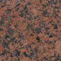 Et nærbillede af en bordplade i rød granit.