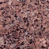 Et nærbillede af en pink granit bordplade.