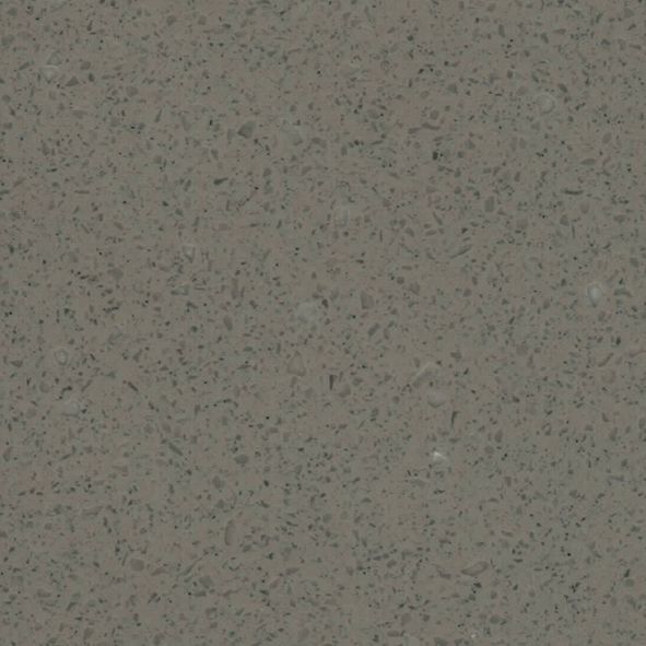 Et nærbillede af en grå flise med små prikker på.