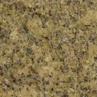 Et nærbillede af en gul granit bordplade.