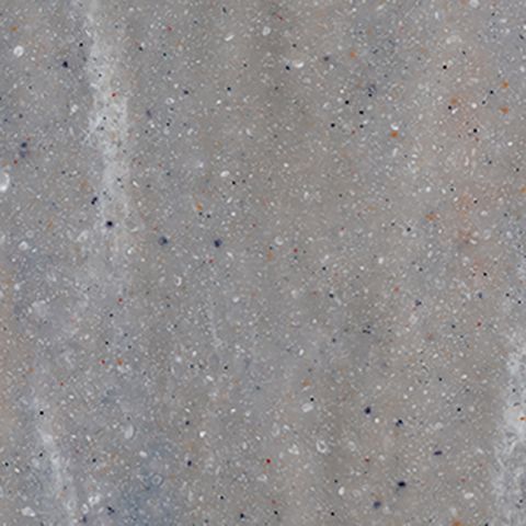 Et nærbillede af en grå overflade med små prikker på