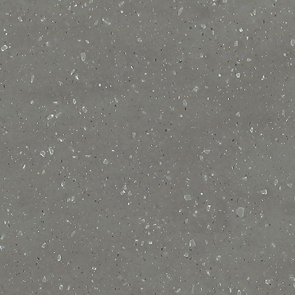 Et nærbillede af en grå overflade med små hvide prikker på.