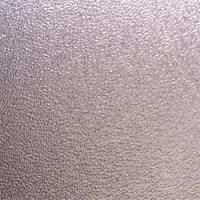 Et nærbillede af en metaloverflade med en metallisk tekstur.