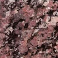 Et nærbillede af en pink granit bordplade.