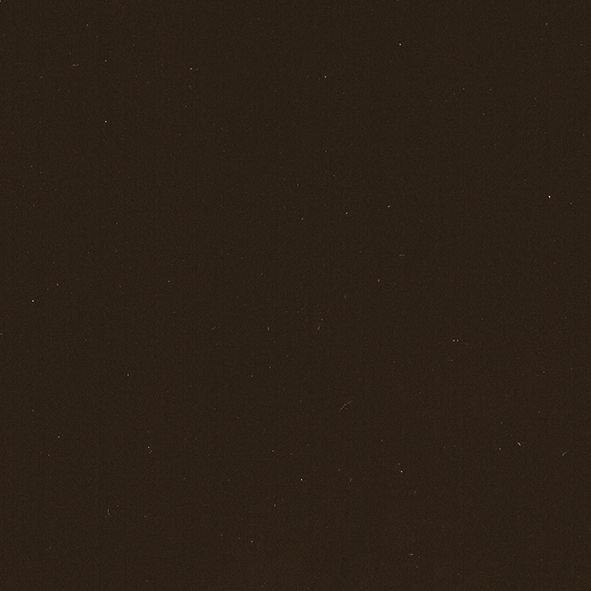 Et nærbillede af en brun overflade med en masse små prikker på.