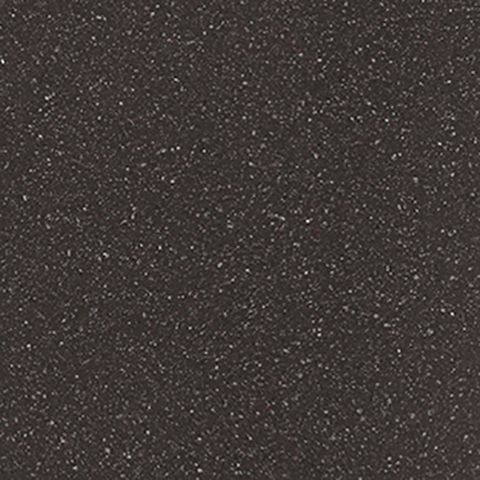 Et nærbillede af en sort overflade med hvide prikker på.