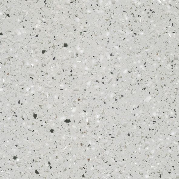 Et nærbillede af en hvid granitbordplade med sorte pletter