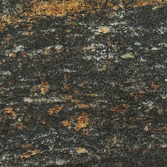 Et nærbillede af en sort og guld granit bordplade.