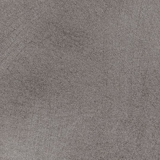 Et nærbillede af en grå flise med en kornet tekstur.