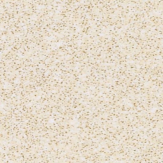 Et nærbillede af en hvid flise med guldglimmer på.