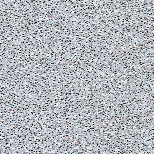 Et nærbillede af en grå baggrund med en masse små prikker på.